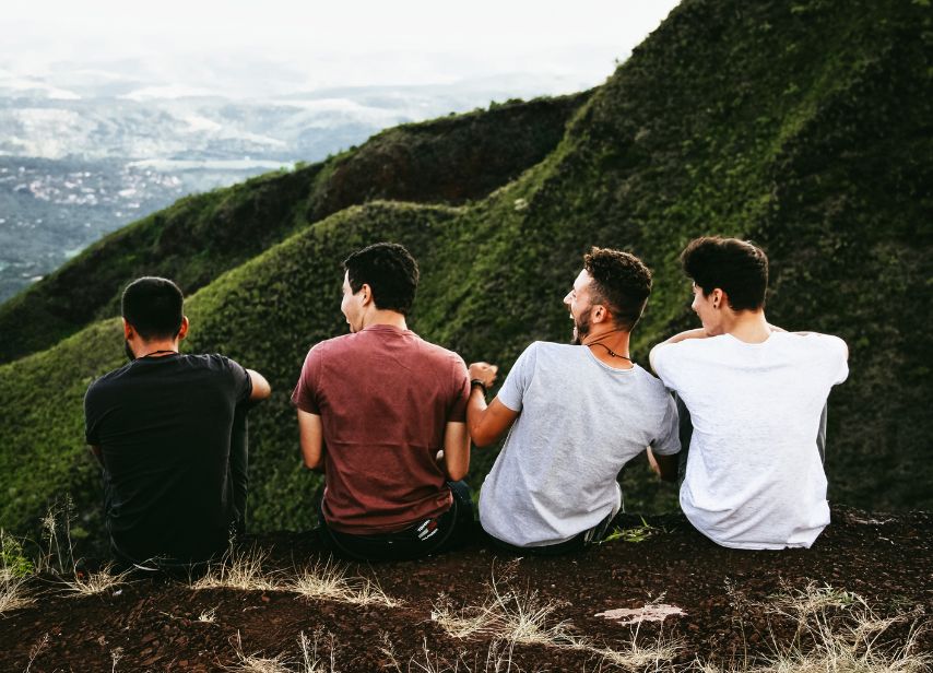 Supportive group of friends symbolizing recovery and connection outdoors